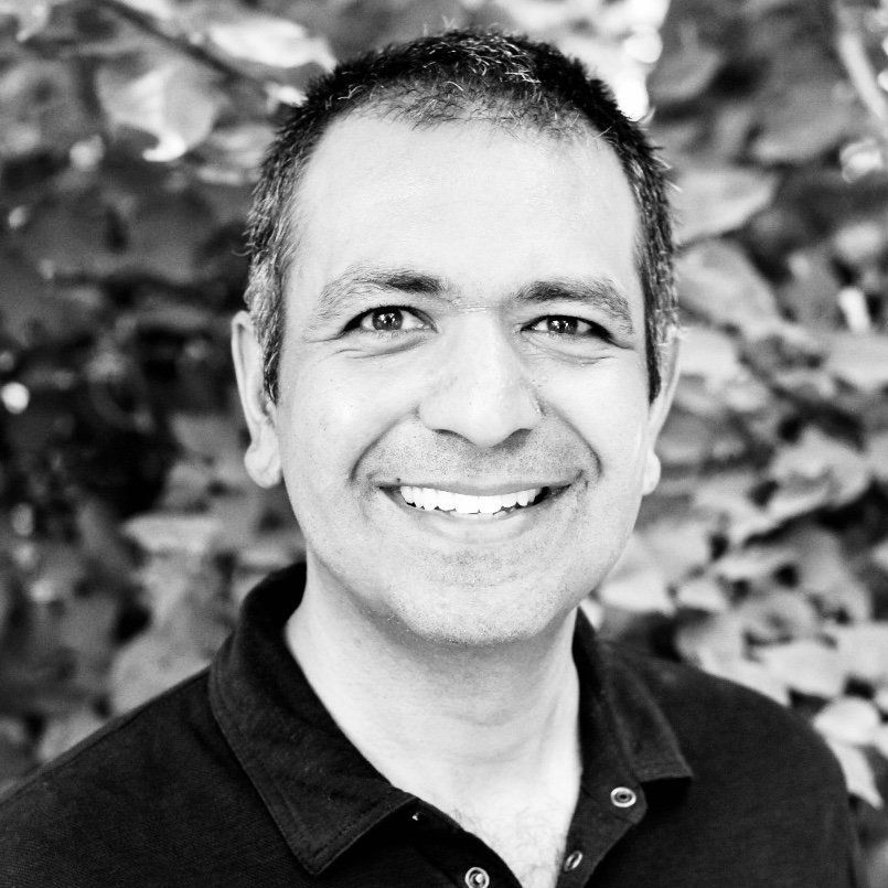 Zuban Bastani, CEO & Founder of ReachWell pictured in a black shirt  smiling 
