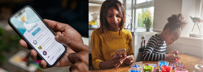 A person is holding a cell phone next to a woman sitting at a table using a cell phone.