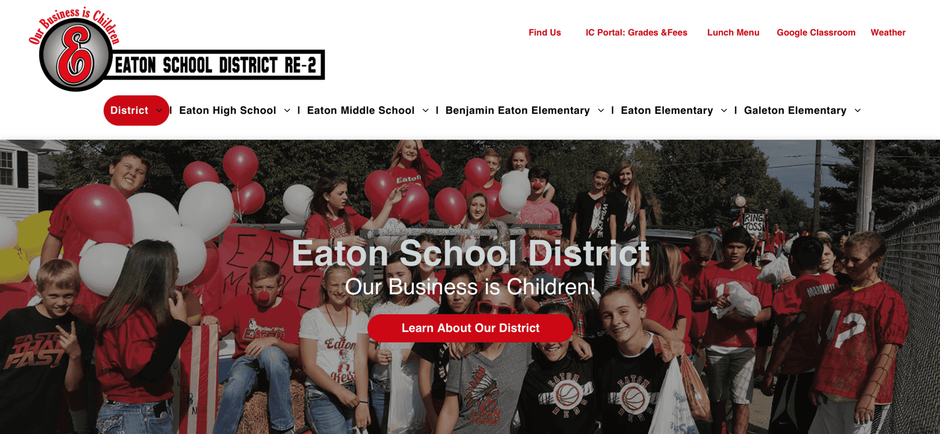 The homepage of the eaton school district website shows a group of people holding red and white balloons.