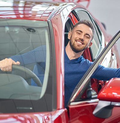 Man in Red Car — Newton, MA — Bikofsky Insurance Agency Inc