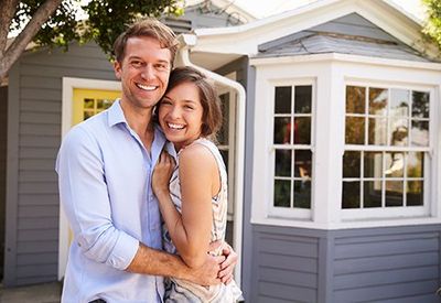 Couple Outside New Home — Newton, MA — Bikofsky Insurance Agency Inc