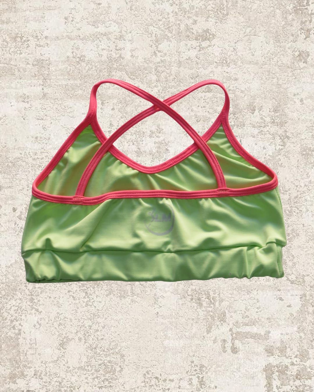 TOP CRUZADO ATRÁS VERDE PASTEL Y FUCCIA COMBINADO