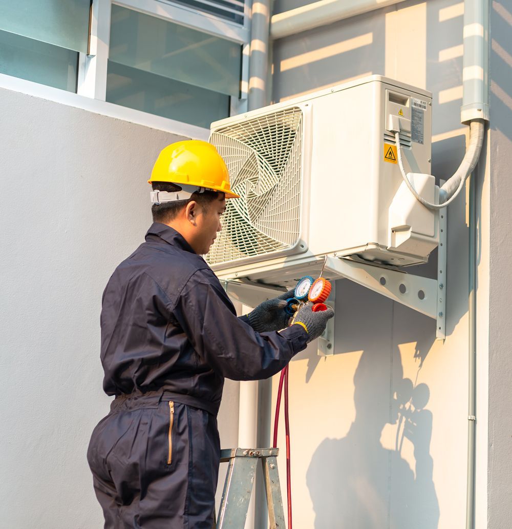 Man Repairing Air Conditioner — Bradenton, FL — Comfort Kings Heating  Cooling & Refrigeration