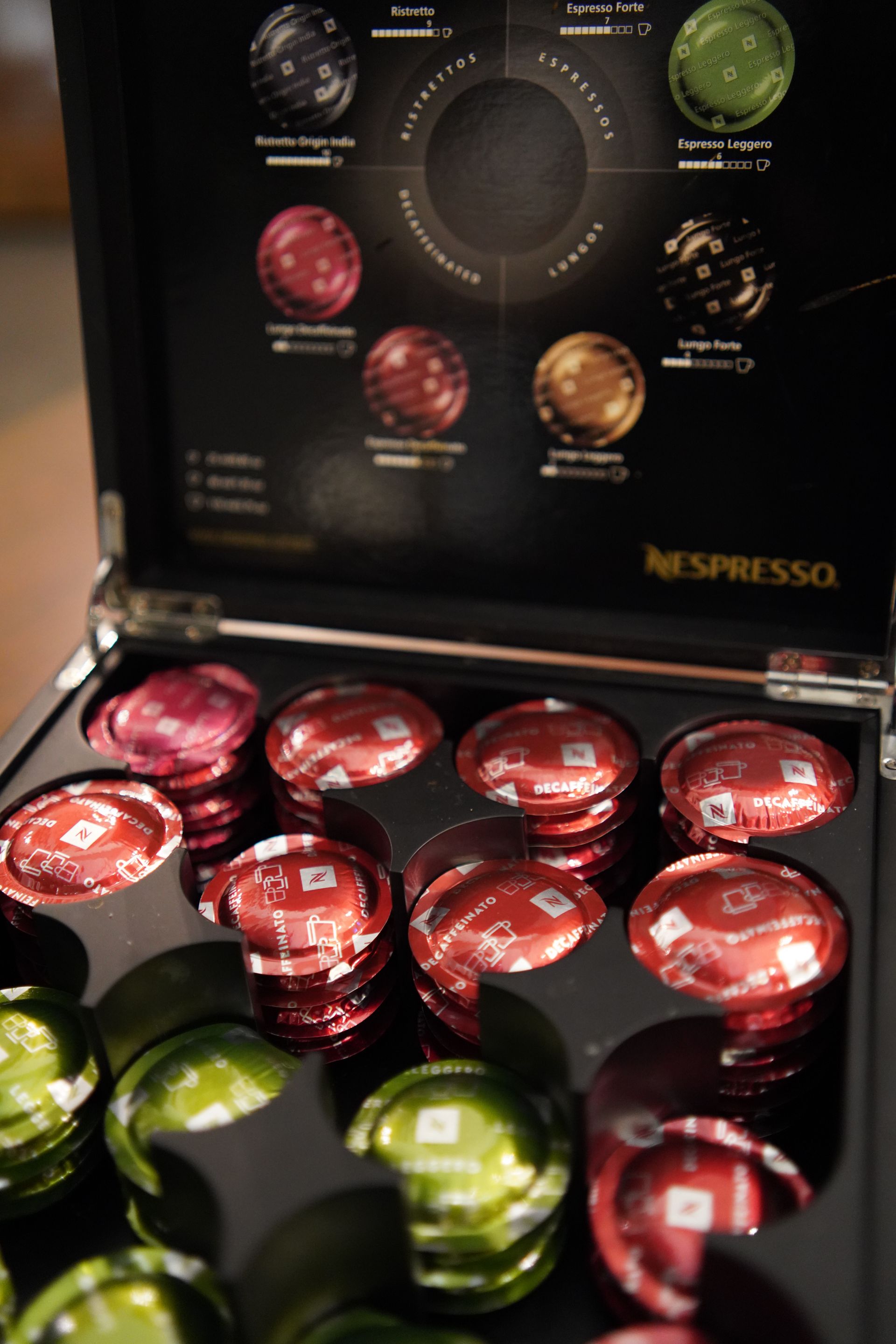 A box of nespresso coffee capsules with different flavors