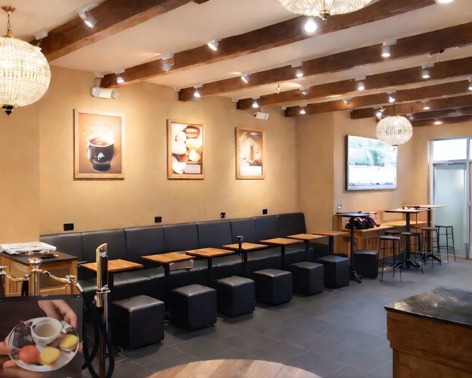 The inside of a restaurant with tables, chairs, and booths.