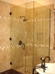 A bathroom with a walk in shower and a bathtub.