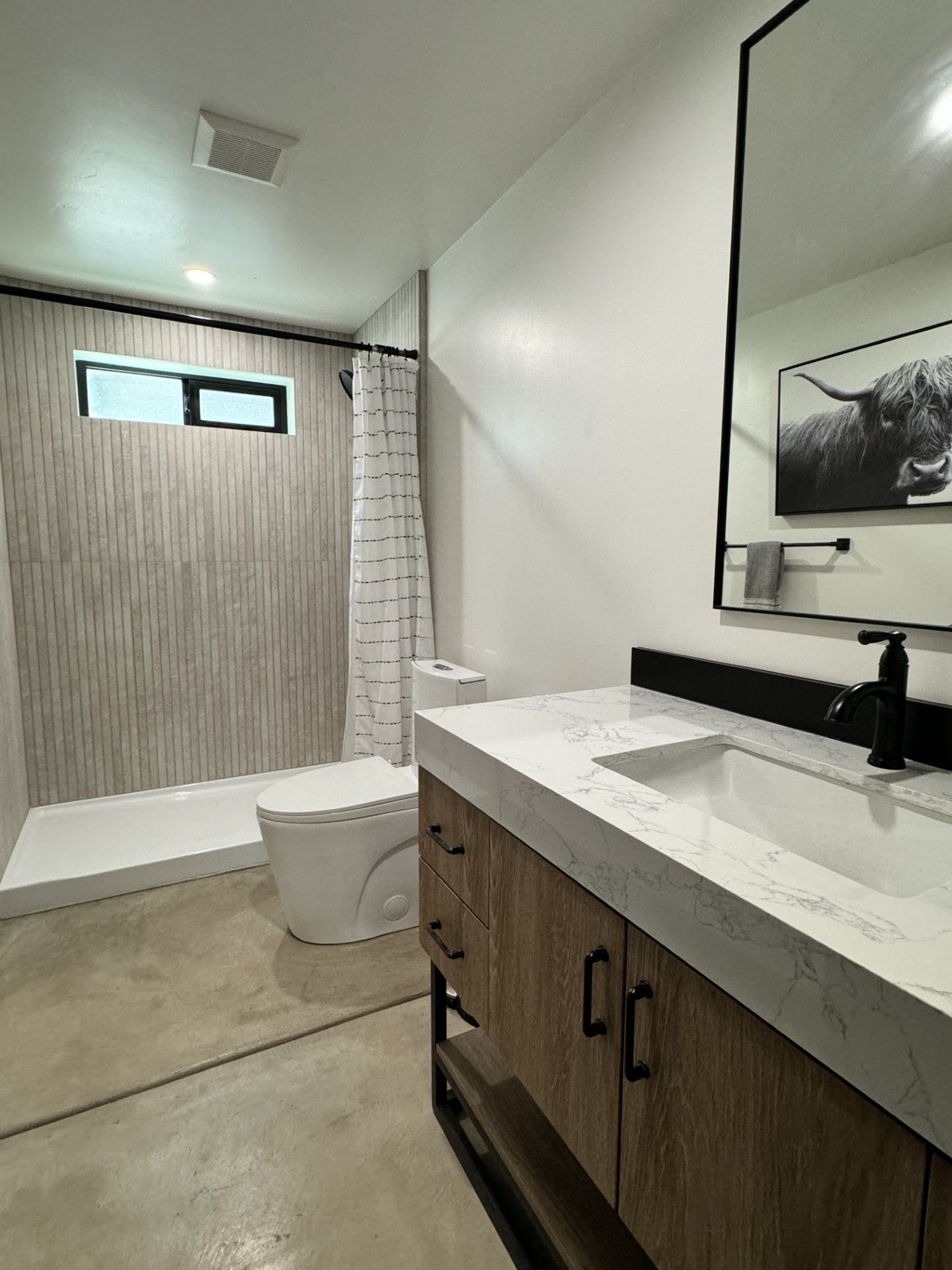 A kitchen with stainless steel appliances and wooden cabinets