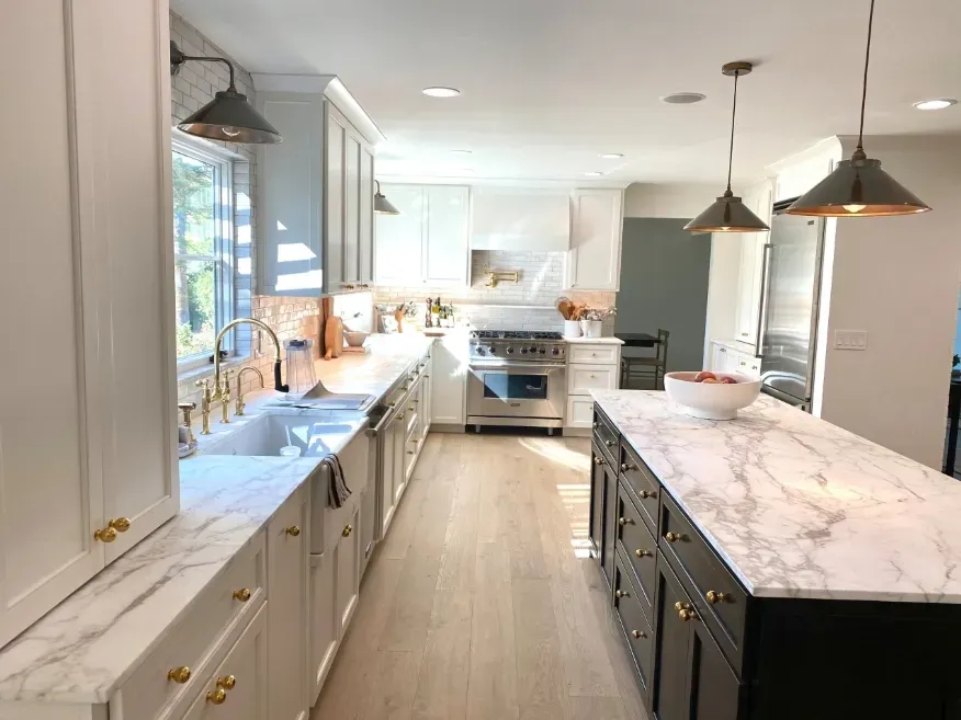A bathroom with two sinks and two mirrors