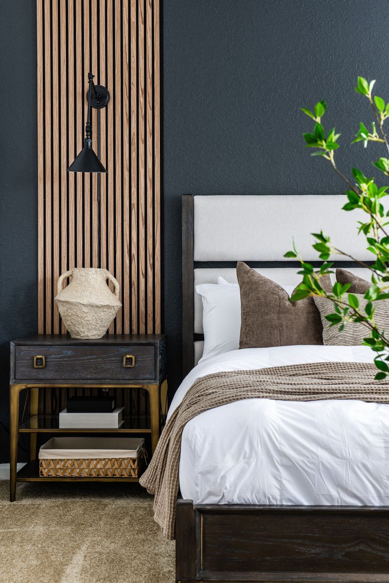 Swimming pool with palm trees and brick patio.