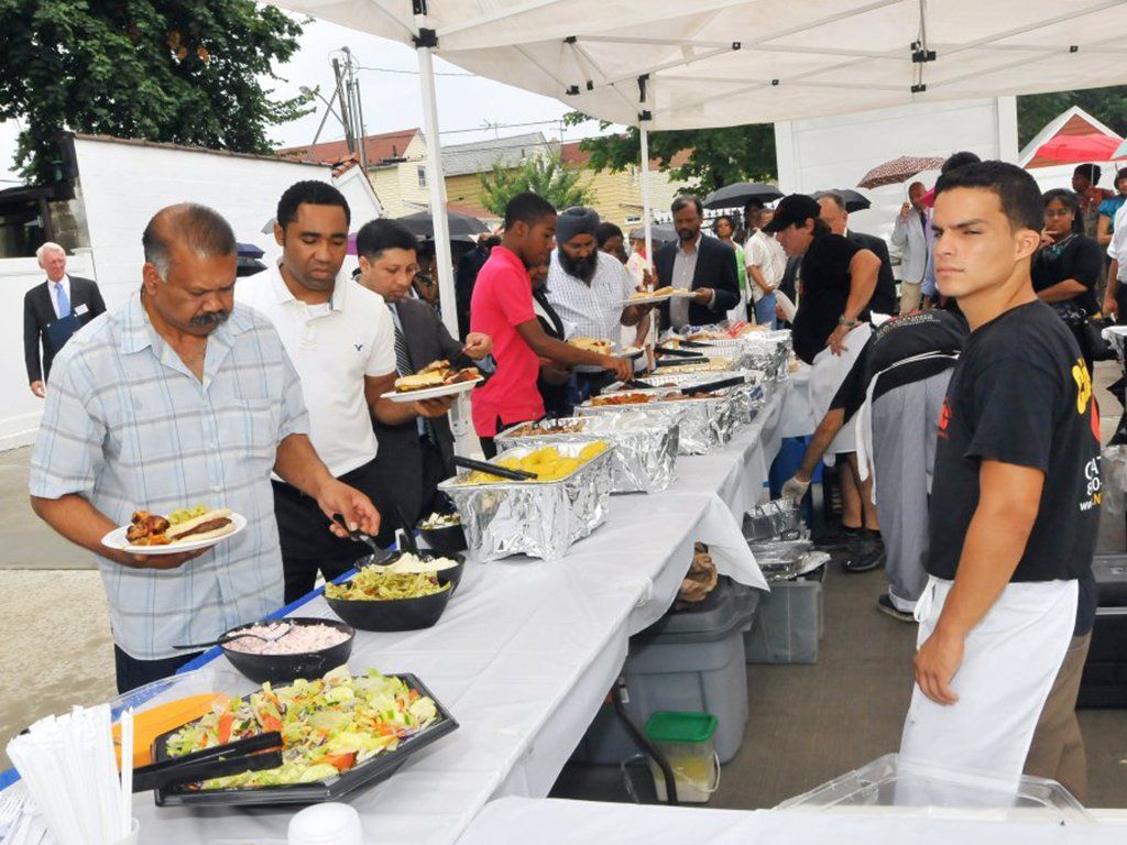 Guests getting their foods on tables