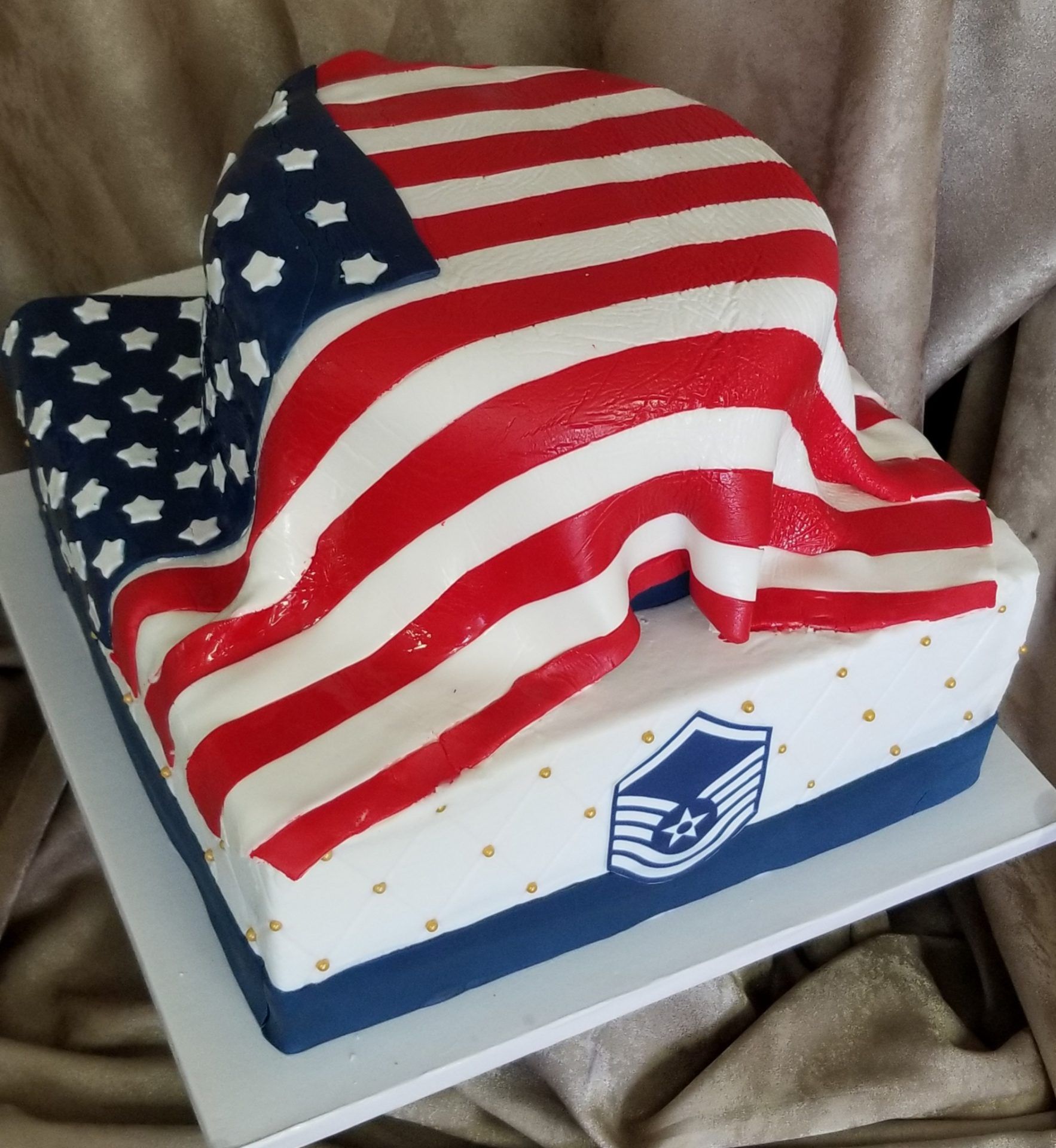 An american flag cake with a shield on it