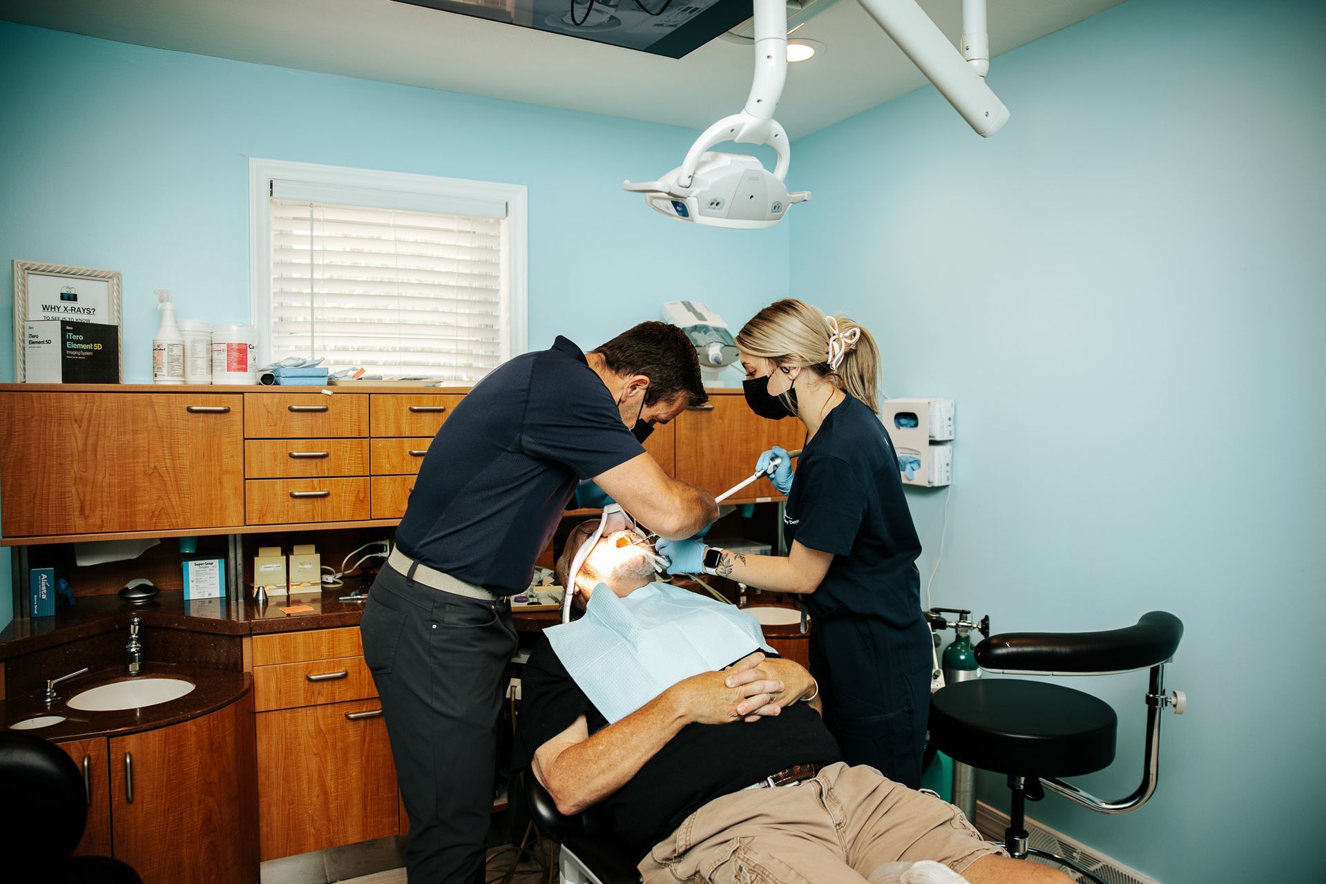 A group of women are posing for a picture in front of a sign that says `` we love to see you smile ''.