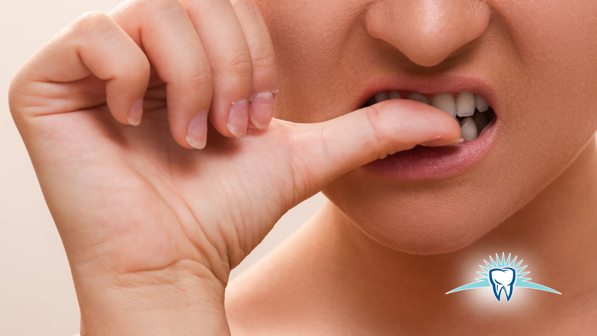 Person biting their fingernail with a worried expression.