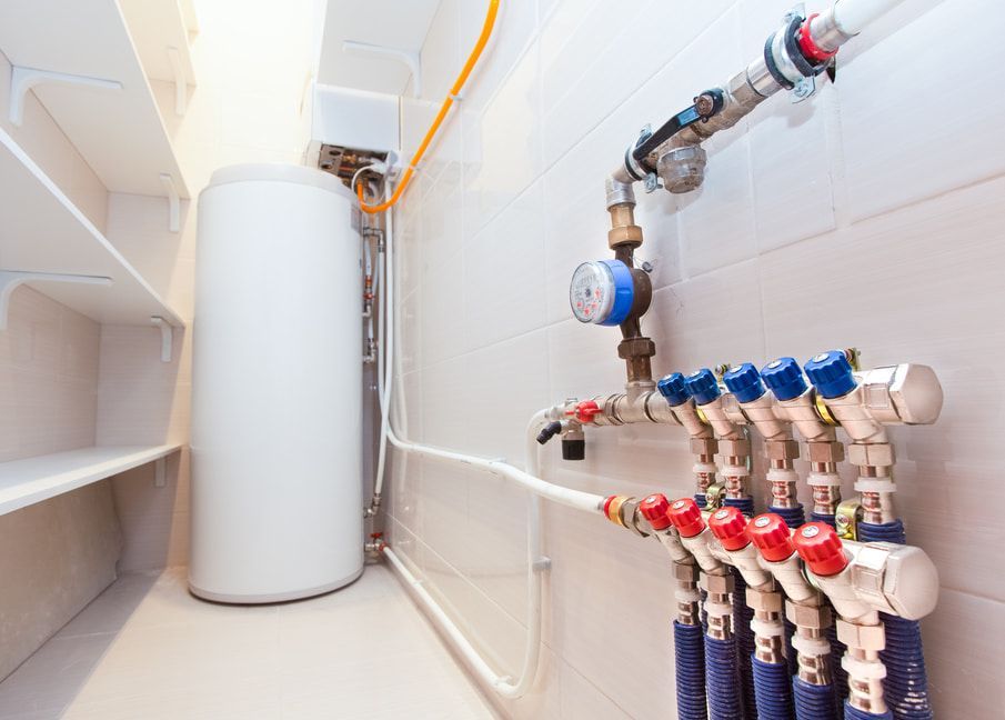 A Room With a Water Heater and a Bunch of Pipes — Plumbtek Solutions In Mudgeeraba, QLD