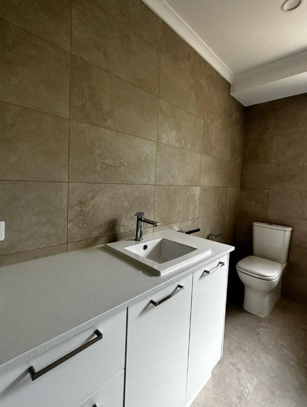 A Bathroom With a Sink and Toilet in It — Plumbtek Solutions In Canungra, QLD
