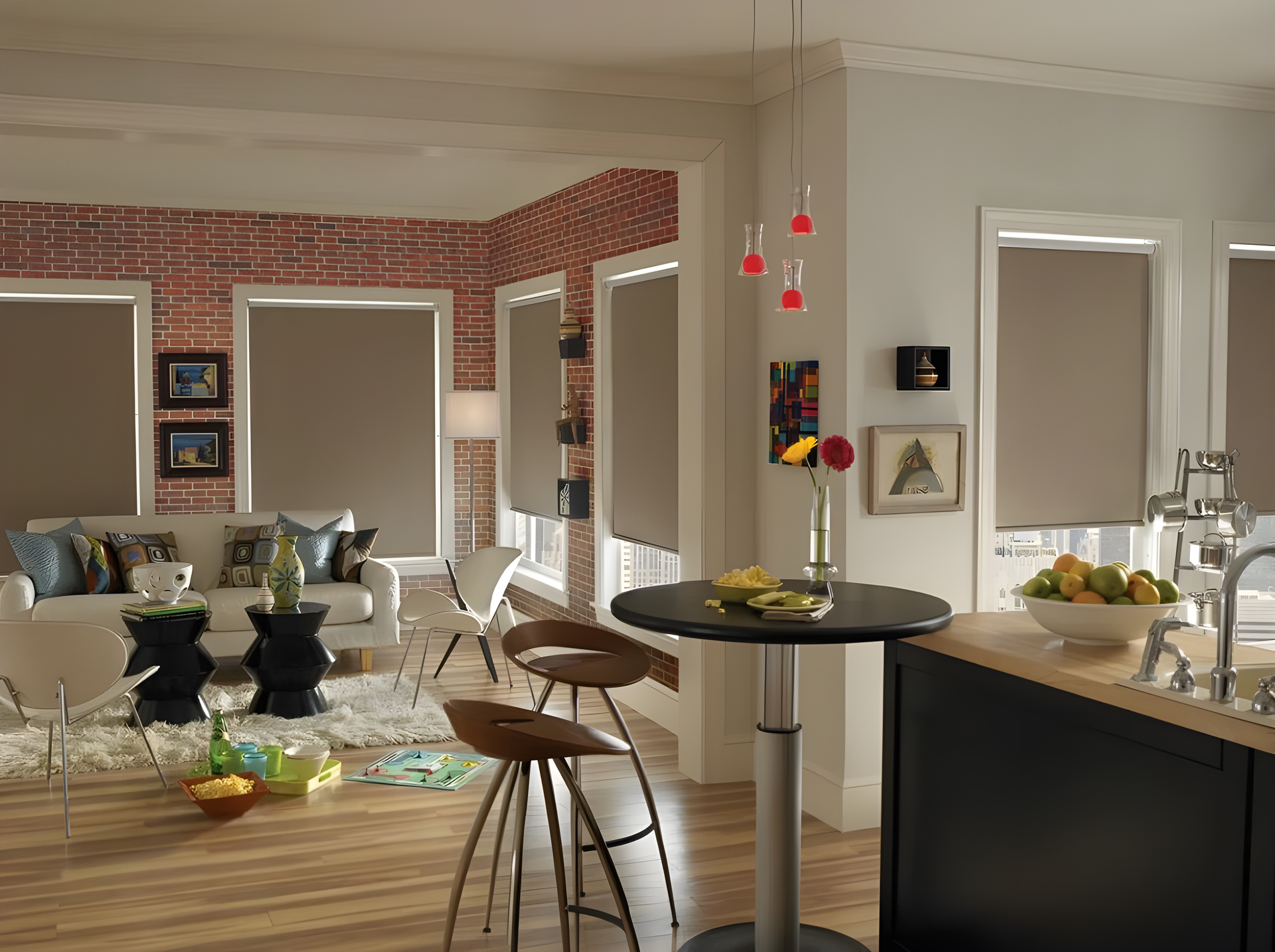 Living room with kitchen and dining area, featuring roller shades.