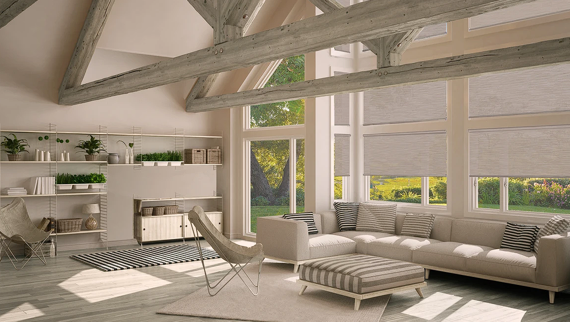 Inviting living room featuring wooden beams, a spacious window, and roller shades.