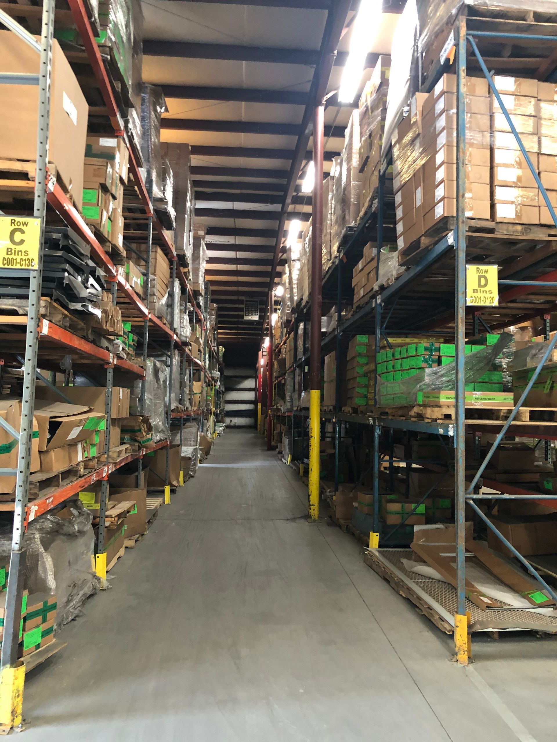 A large warehouse filled with lots of shelves and boxes