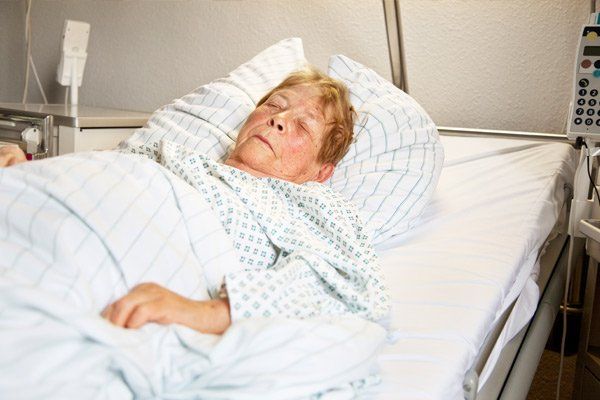 Senior Woman Lying in bBed
