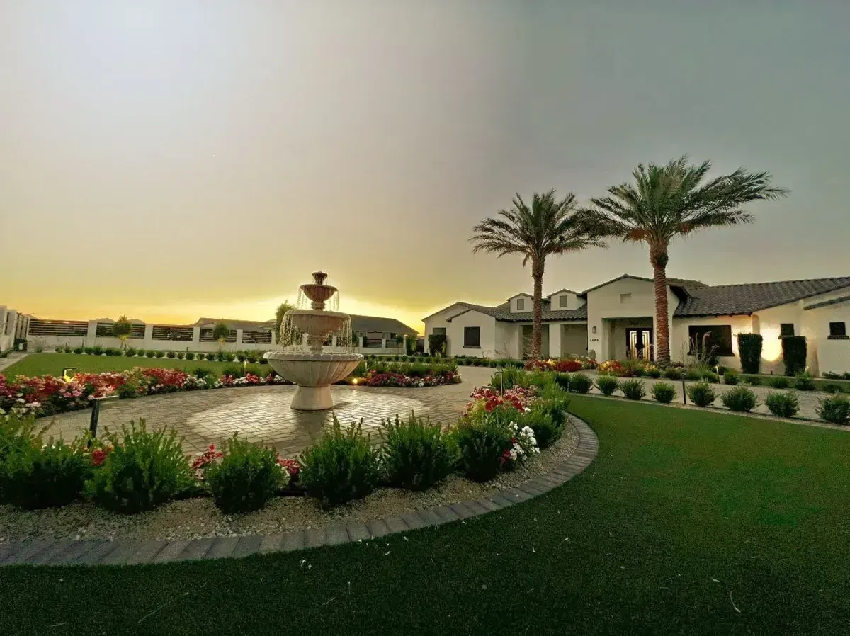 Modern front yard exterior home design with stone walkway pathway lighting and Arizona desert landscaping