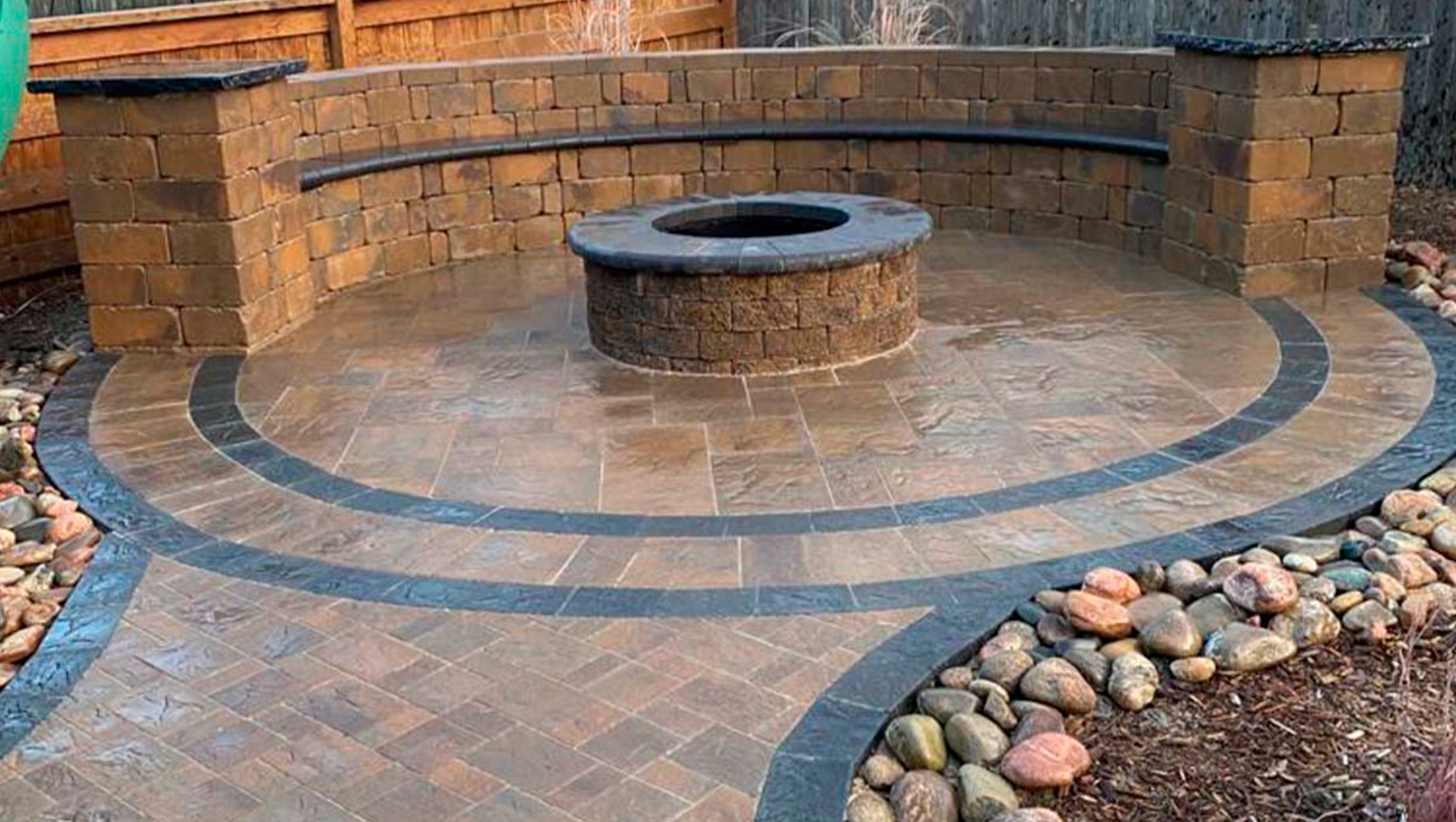 There is a fire pit in the middle of the patio.