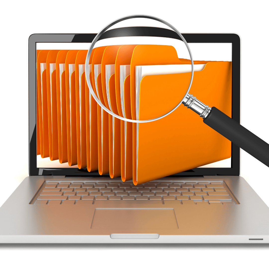 Laptop screen displaying orange file folders, magnified by a magnifying glass.