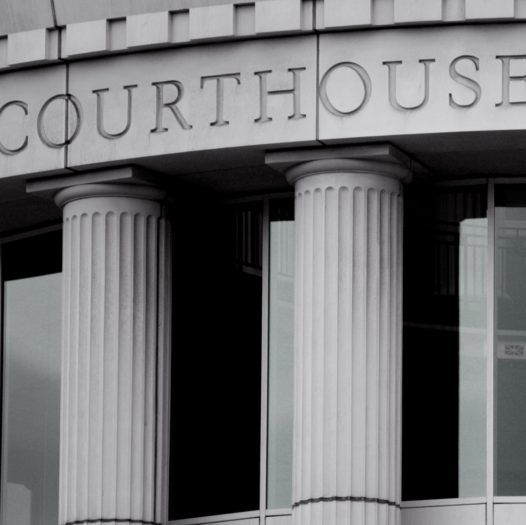 Courthouse entrance with fluted columns and the word 