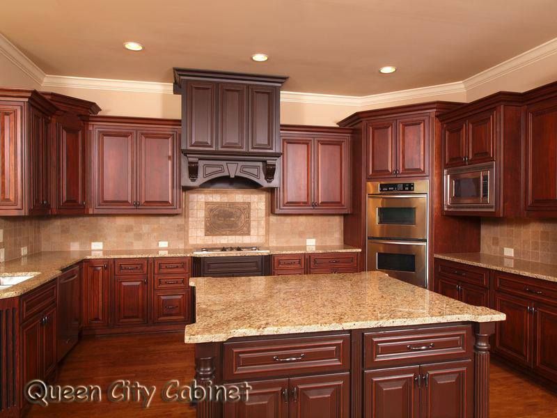 A kitchen with wooden cabinets and granite counter tops