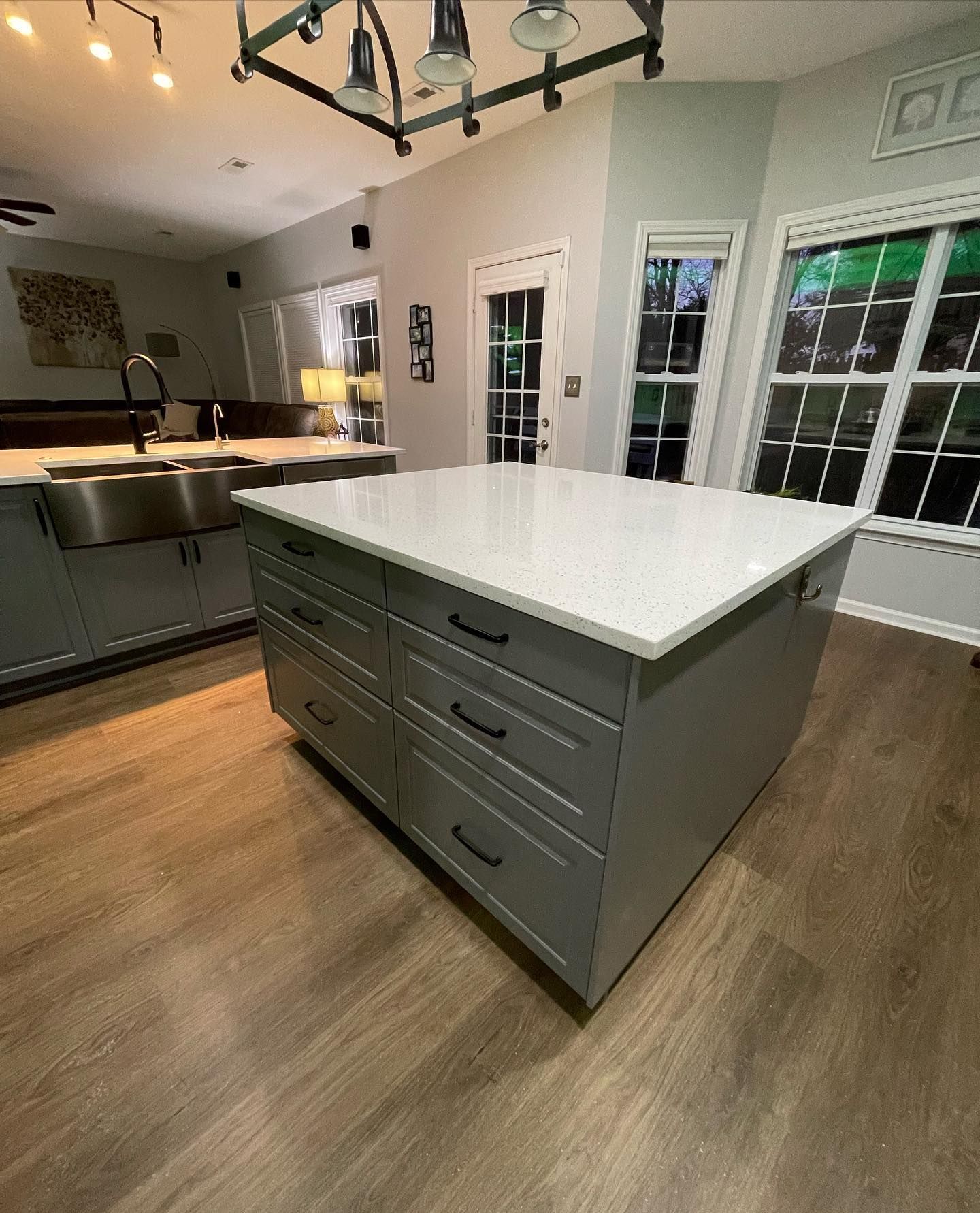 A kitchen with a large island in the middle of it.