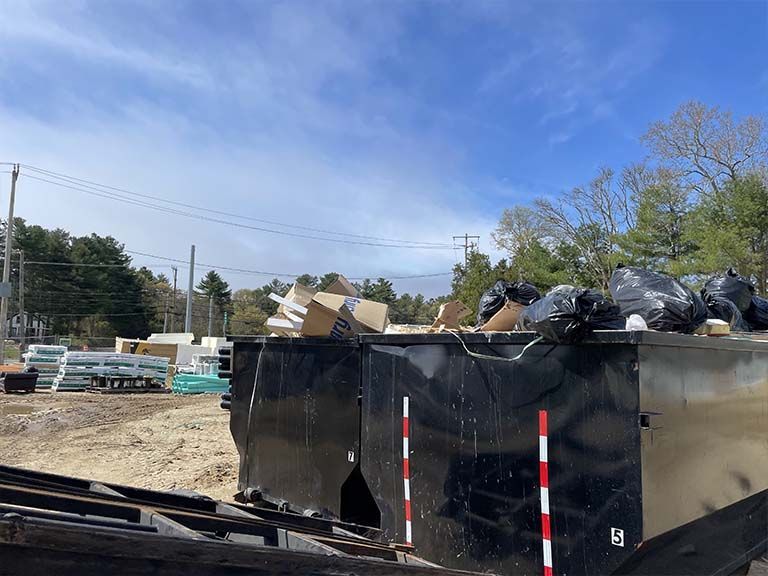 Process of Loading a Dumpster