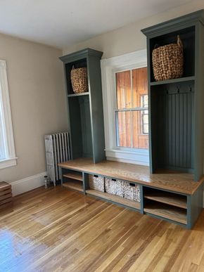 Woman in room taking cleaning supplies from a box.