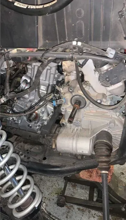 A close up of a motorcycle engine sitting on top of a table.