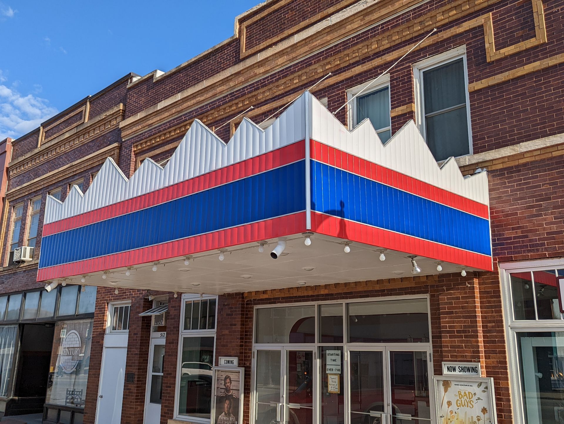 Commercial building being painted by professional crew