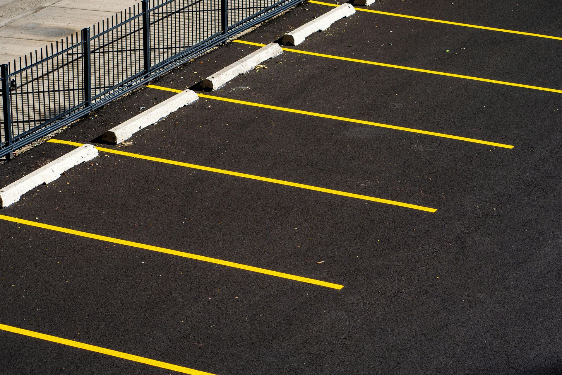 Freshly striped commercial parking lot with ADA markings