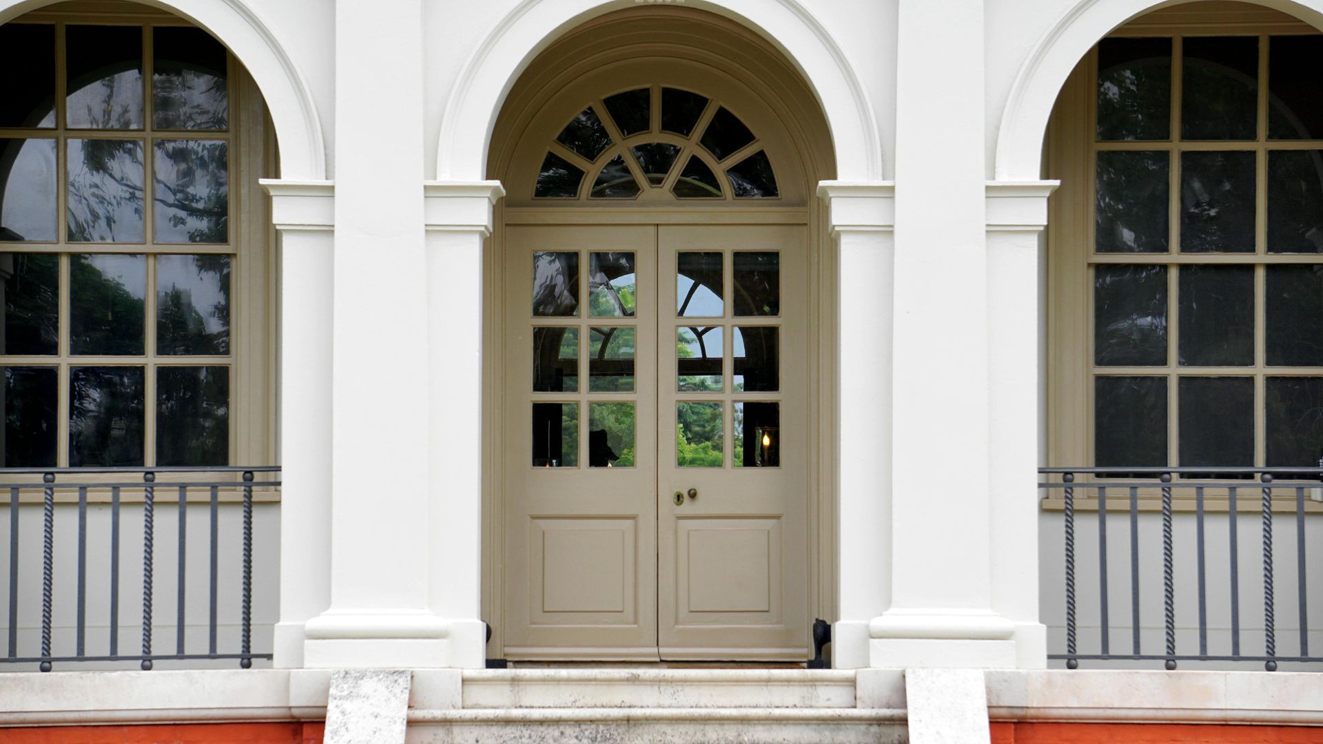 Painting front door and window trim on a home exterior