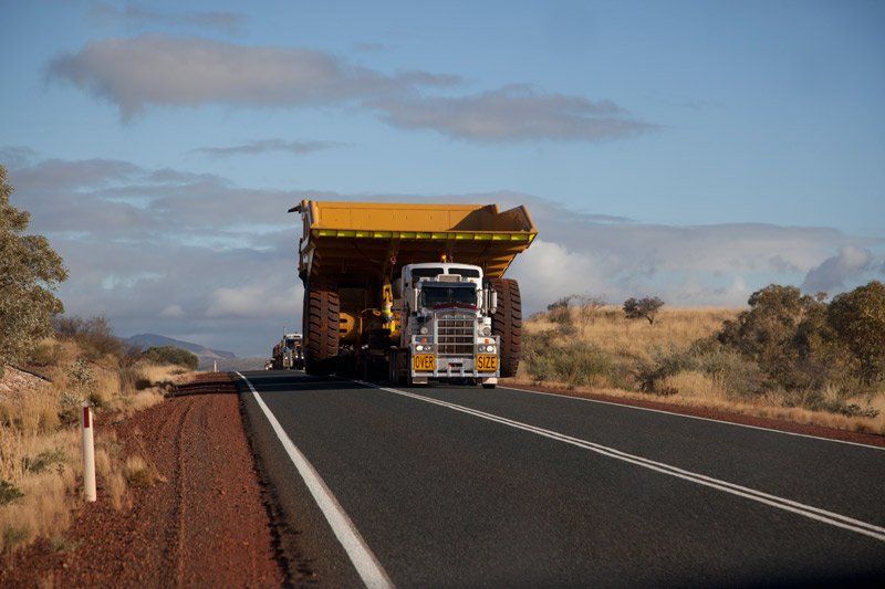 wide load truck on desert highway