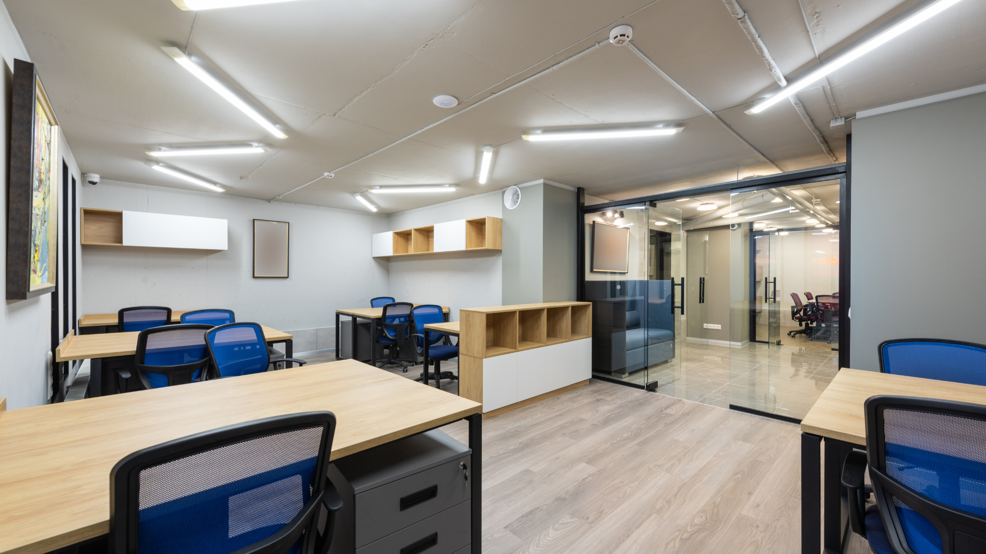 A group of doctors are standing in a hospital hallway.