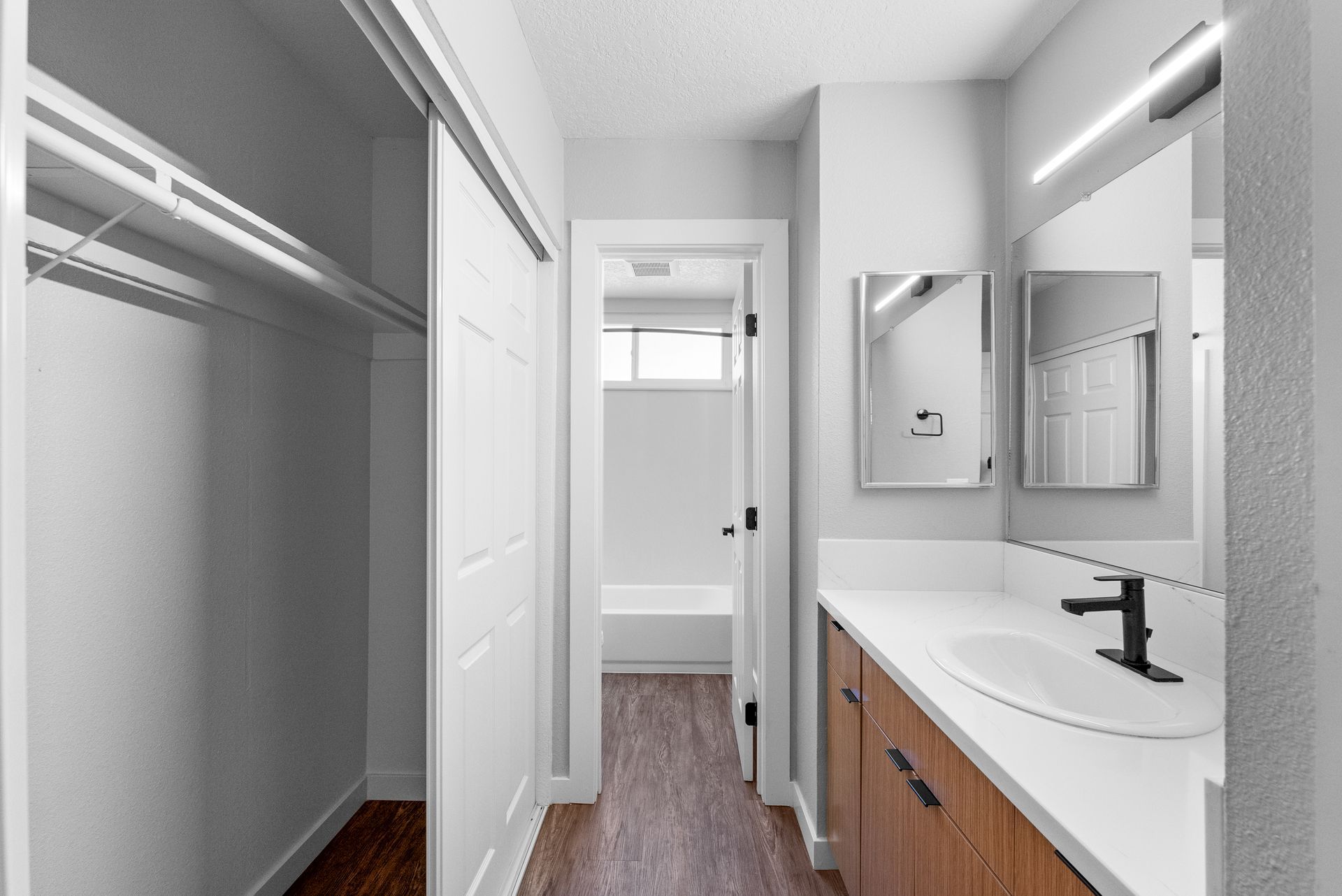 Hallway with closet and sink