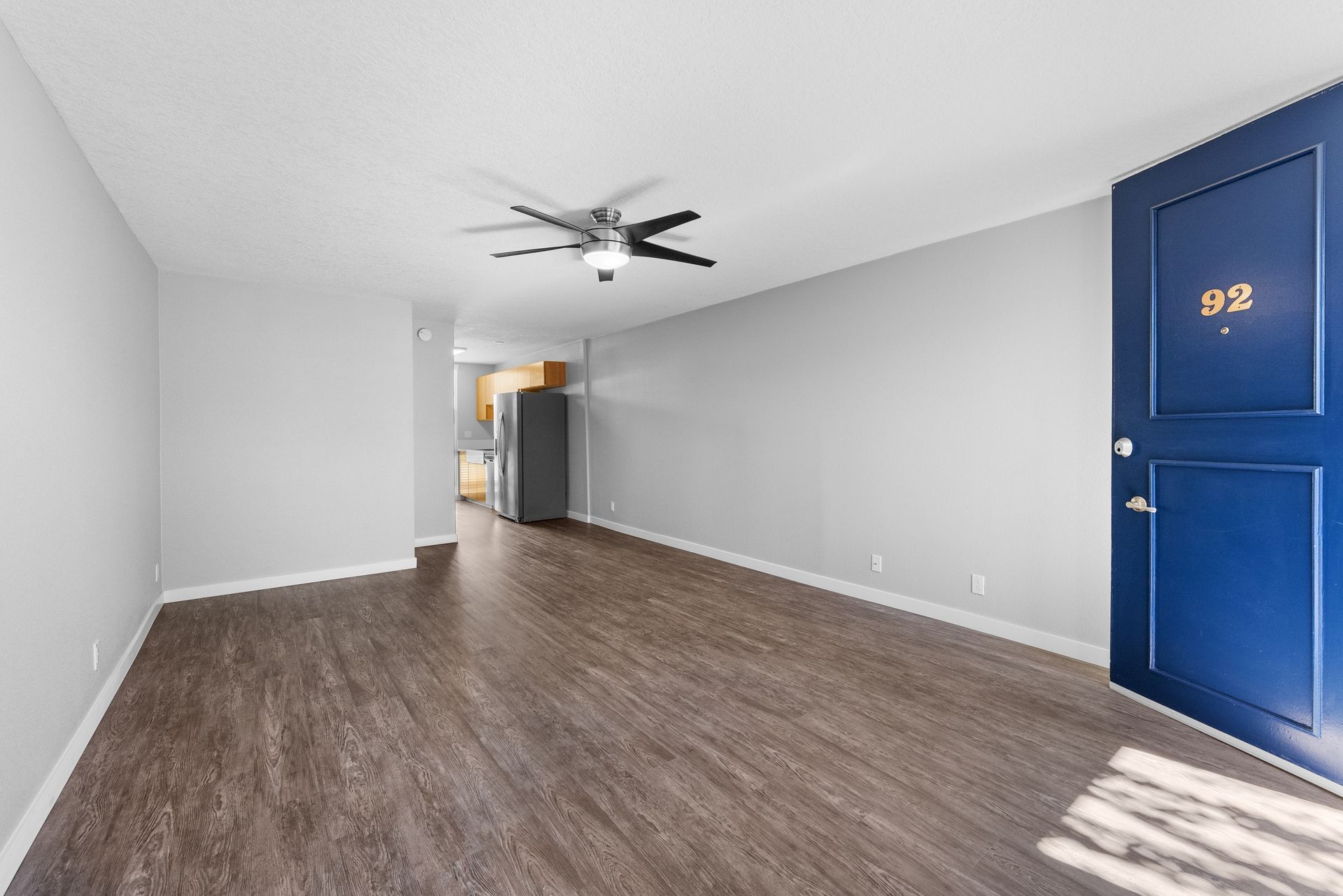 Empty living room with wood floors