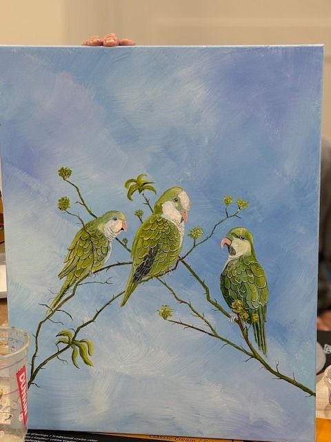 A painting of three green birds sitting on a branch