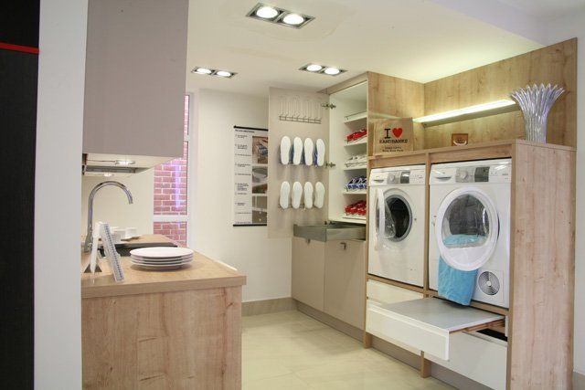 A practical kitchen with laundry cupboards and storage keeping the kitchen clean and tidy but still practical for all your needs.