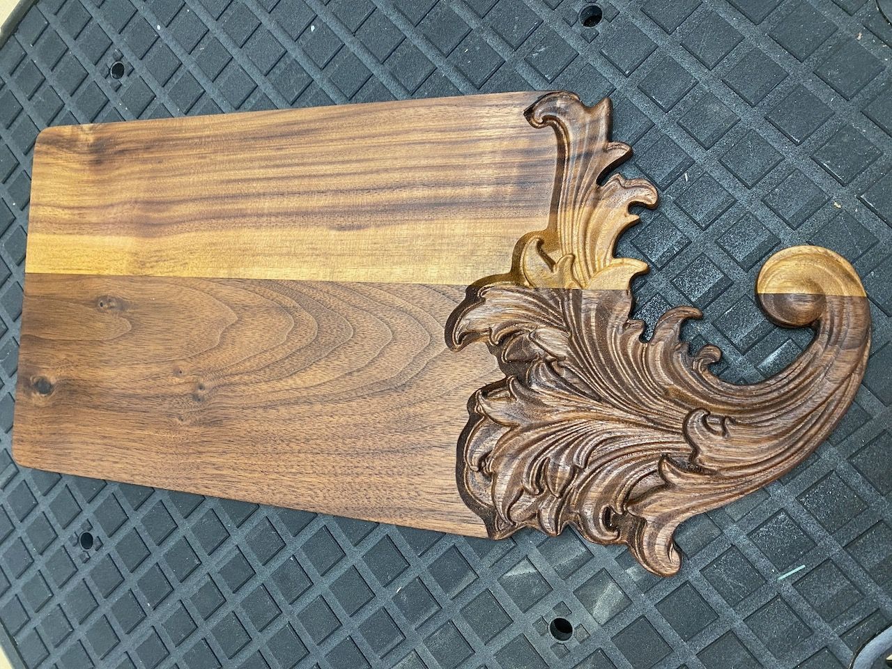walnut charcuterie board with cnc carve