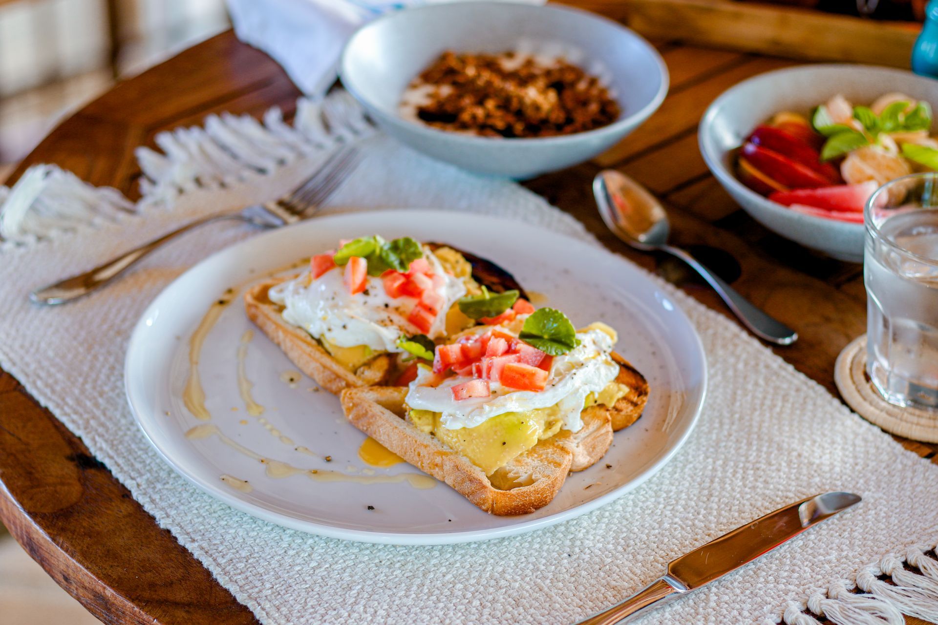 A plate of food is sitting on a wooden table.