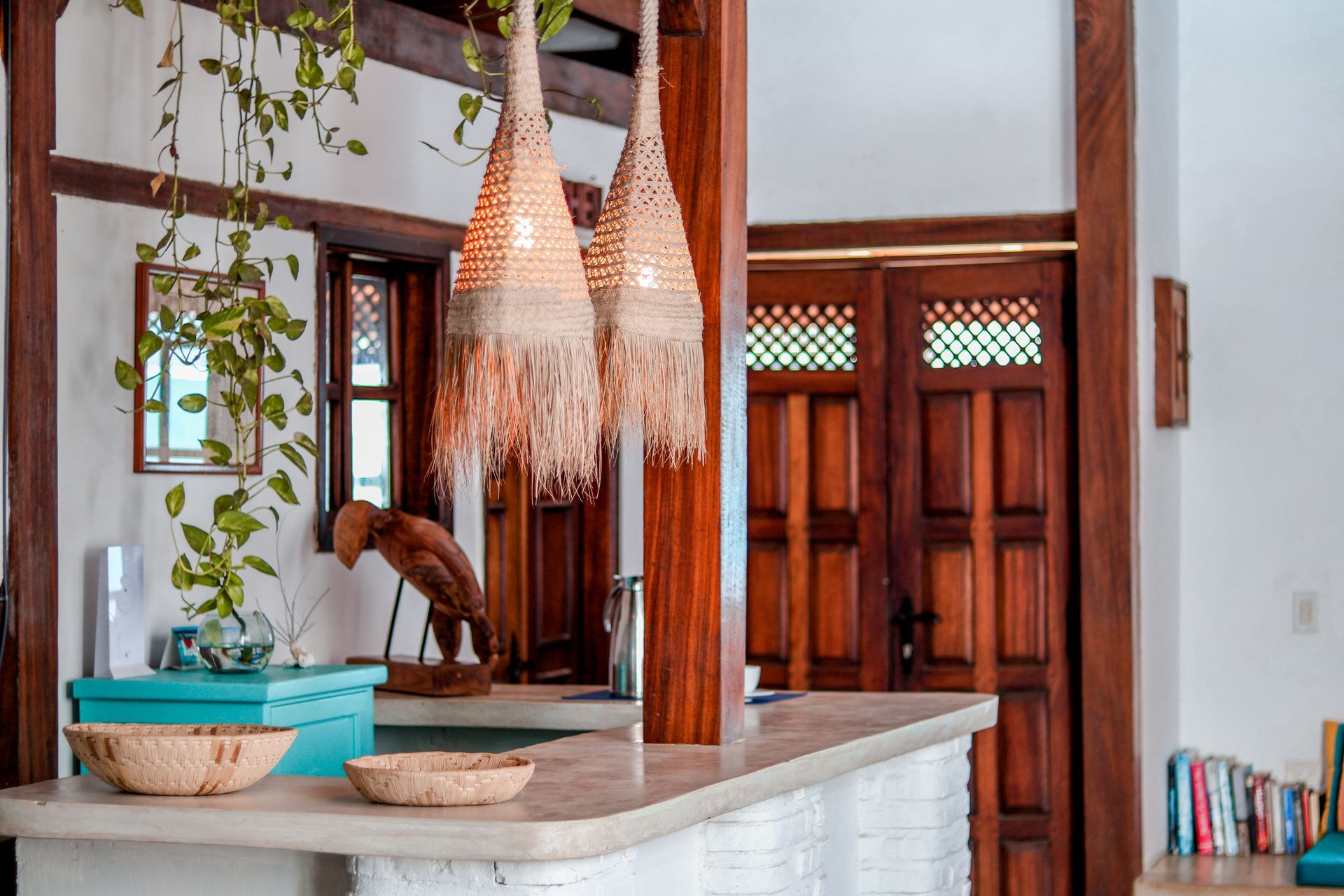 A kitchen with a counter and a wooden door.