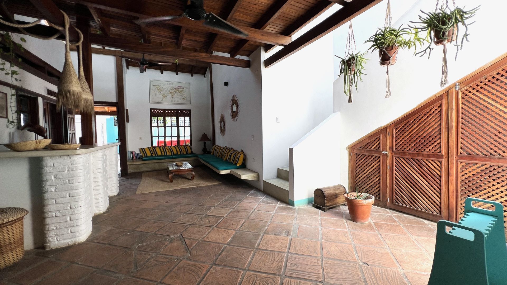 A large room with a staircase leading up to the second floor