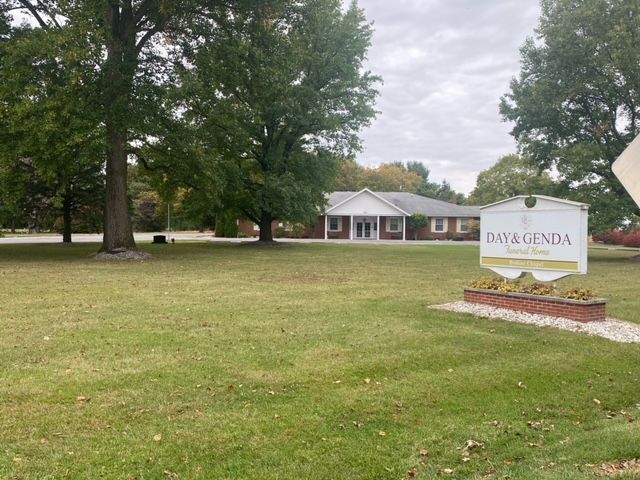 Old Front signage with grass and view of Bodine Chapel Day & Genda Funeral Home in IN.