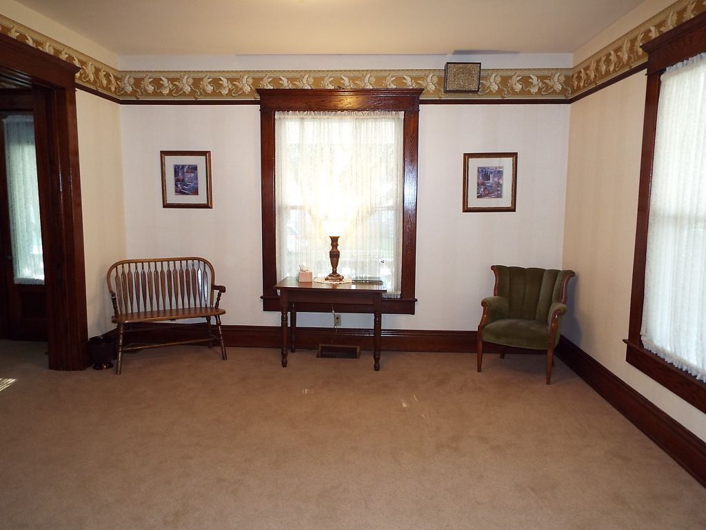 a room with tables and chairs with a sign on the wall that says ' a ' on it