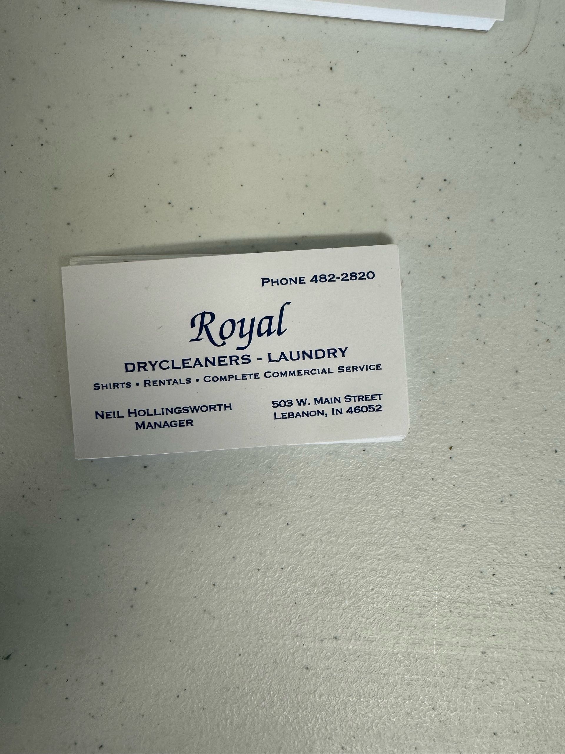 a business card for royal drycleaners and laundry
