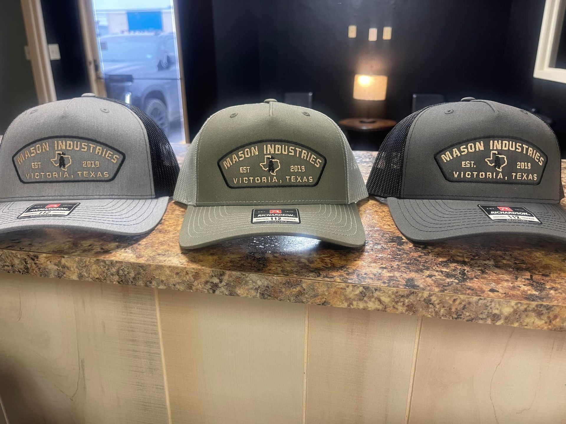 Three trucker hats with 
