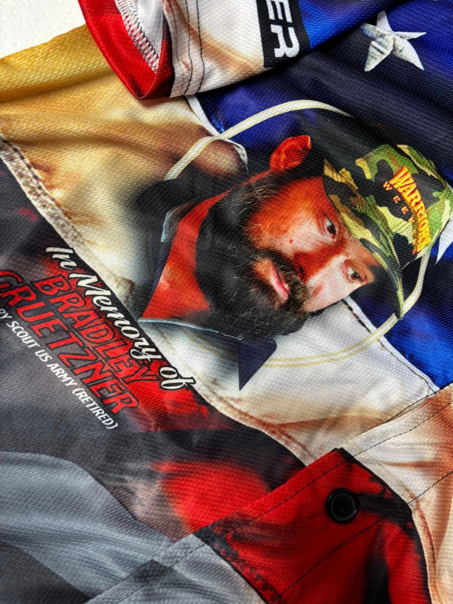 Close-up of a fabric with a portrait of a man with a beard and camouflage hat, Confederate flags, and text.